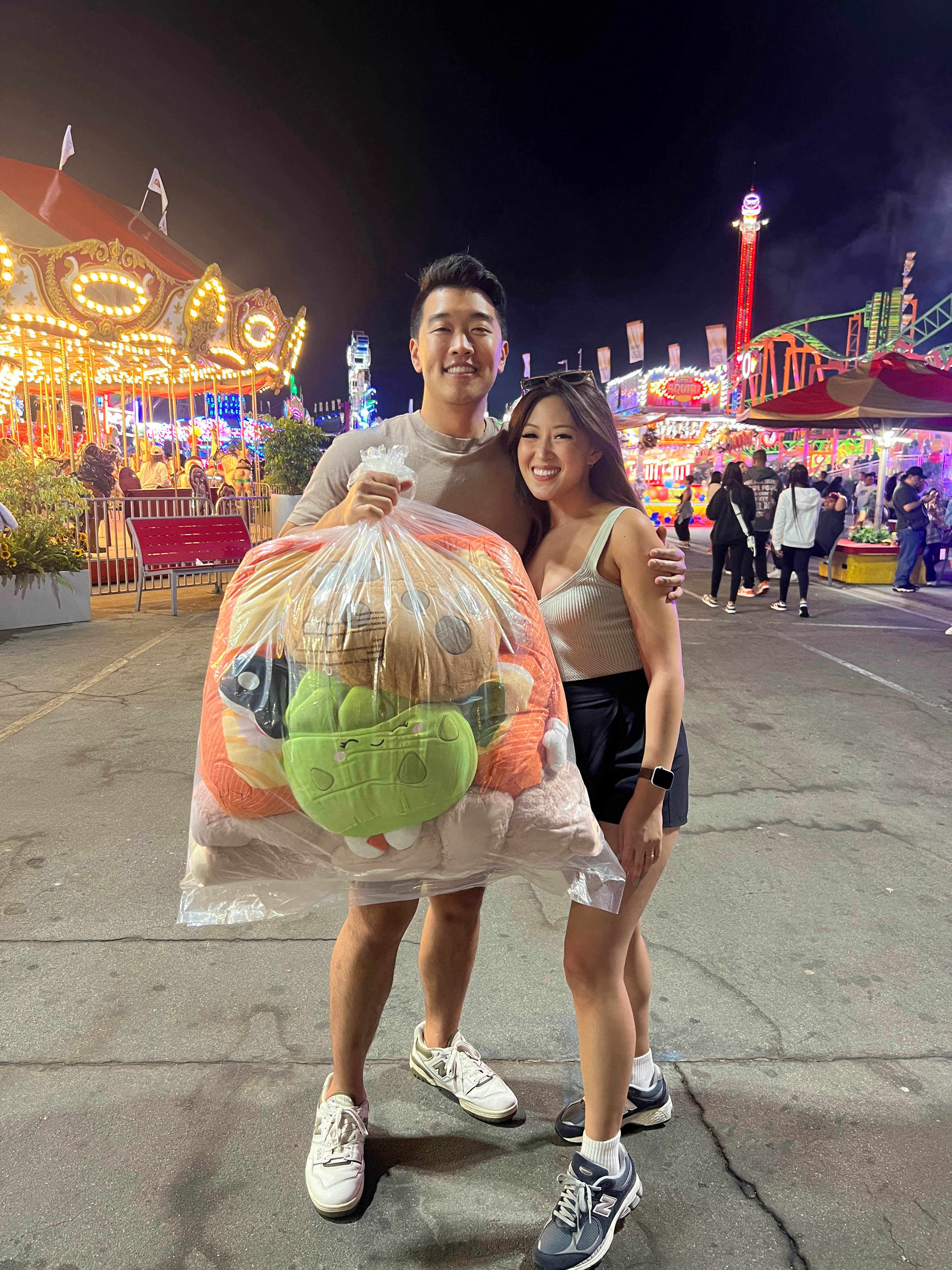 Aaron and Danielle at OC Fair playing claw machines